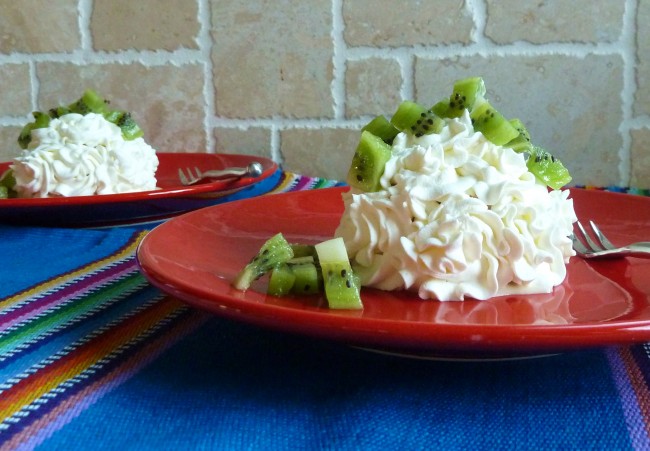 Pastel de Tres Leches garnished with kiwi